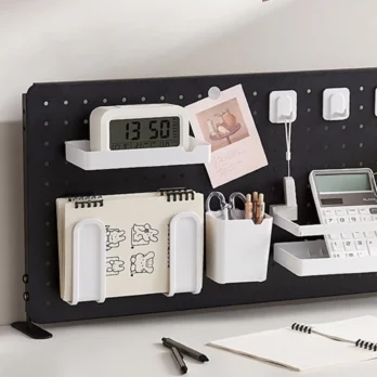 A Black Metal Desk Pegboard with some office accessories
