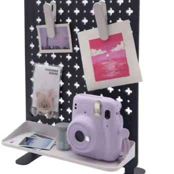 Postcards, photos and a camera on the Plastic Desk Pegboard