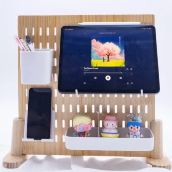 Cute toys, an iPad, an iPhone, and pens on the Wooden Desk Pegboard